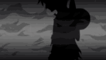 a shadow of a person laying on the ground in a dark room