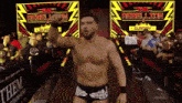 a wrestler with a sign that says " all ego "
