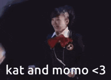 a group of people are hugging each other with the words kat and momo < 3 written on the bottom .