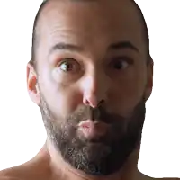 a man with a beard is making a funny face with his mouth open