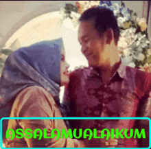 a picture of a man and a woman kissing with the words assalamualaikum in the corner