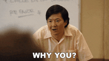 a man in a white shirt says why you