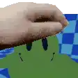 a close up of a person 's hand on a green frog .