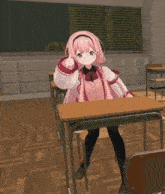 a girl with pink hair sits at a desk in a classroom giving a thumbs up
