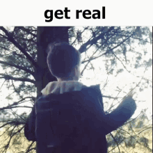 a picture of a person standing in front of a tree with the words " get real " above them