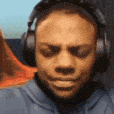 a man wearing headphones looks at something