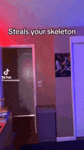 a room with a picture on the wall that says ' steals your skeleton ' on it