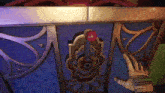 a hand is reaching for a red button on a purple box