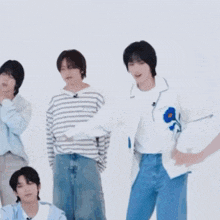 a man in a blue shirt is dancing with another man in a white shirt