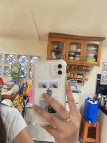 a woman is taking a picture of herself in a mirror