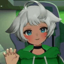 a girl with white hair and blue eyes is wearing a green hoodie and waving at the camera .