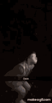 a blurry picture of a person 's face in the dark with a caption that says deek .