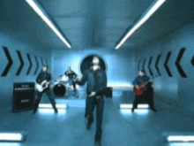 a group of men are playing instruments in a room with arrows on the walls