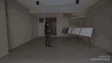 a woman opens a door next to a sign that says made in animonica