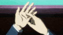 a close up of a person 's hands with their fingers together