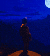 a man holding a torch stands in front of a full moon