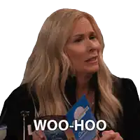 a woman holding a book that says woo hoo on it