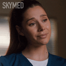 a close up of a woman 's face with the word skymed on the bottom
