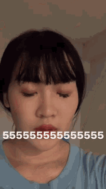 a close up of a woman 's face with the words 5555 on it