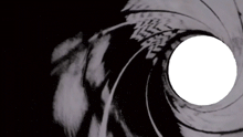 a close up of a gun barrel with a white hole in the middle