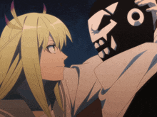 a woman with horns looks at a man with a skull mask on his face