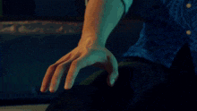 a man and woman are touching each other 's arms