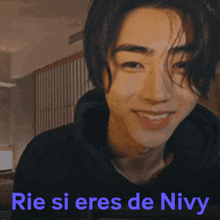 rie si eres de nivy is written on a picture of a smiling young man