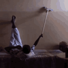 a person laying on a bed taking a selfie
