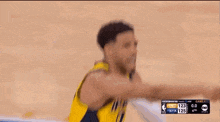 a basketball player is holding a basketball during a game against the nyk