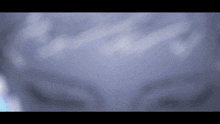 a blurry picture of a person 's face with a purple background