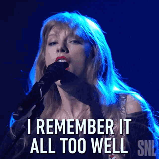 a woman singing into a microphone with the words 