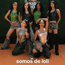 a group of young women are posing for a photo with the caption somos de loli
