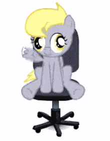 a pony with a yellow mane is sitting on a chair .