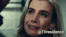 a close up of a woman 's face with a caption that says ' @tvresidence ' on it .