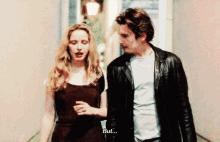 a man and a woman are walking and the woman says " but "