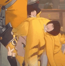 a close up of a person wearing a yellow hoodie with a tiger print .