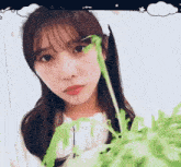a girl with a white bunny ear headband looks at the camera