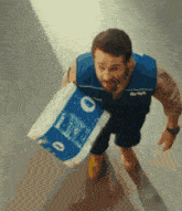 a man carrying a roll of toilet paper with the number 0 on it