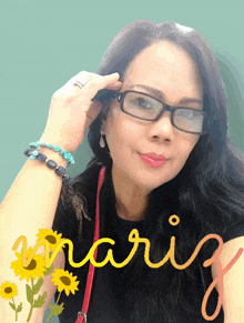 a woman wearing glasses and a black shirt has the name mariz written in yellow letters