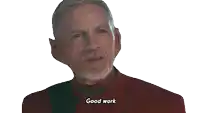 a man with a beard in a red uniform says good work