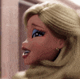 a close up of a barbie doll 's face with blonde hair and earrings