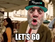 a man with a beard wearing a hat that says blizzard x says let 's go