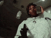 a man holding a gun and a stack of money in his hand