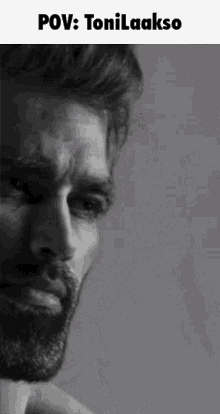 a man with a beard is shown in a black and white photo with the caption pov : tonilaakso