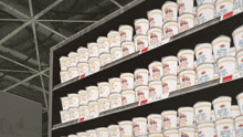 a shelf full of cup noodles with a price tag that says 340