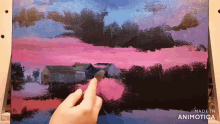 a person is painting a landscape with a brush and the words made in animotica are visible