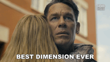 a man is hugging a woman with the words " best dimension ever " on the bottom
