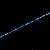 a blue and white flame is coming out of the ground