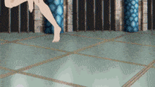 a woman 's bare feet are shown on a tiled floor in a room