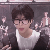 a close up of a person wearing glasses and a white shirt that says ' i love you ' on it